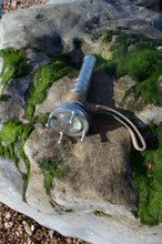 Siebe Gorman diver torch AP 4456 – front angle on rock with green sea moss